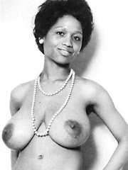Black retro babe showing her massive natural boobs