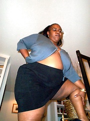Full black girl posing at home